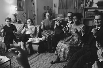 William and Daisy Myers, the first African American residents of Levittown, Pa., socializing with their neighbors.