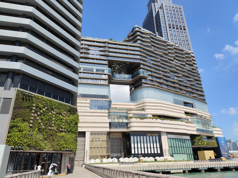 a very tall building next to a body of water