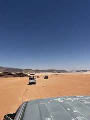 Fullscreen looping video snippet of a dramatic desert shootout scene.