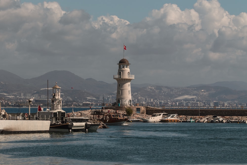 a light house sitting on top of a body of water