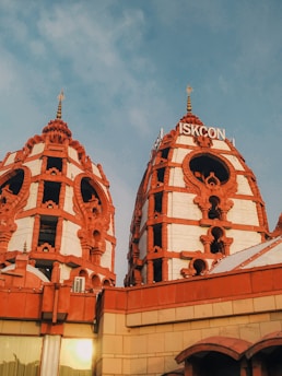 a building with two towers and a sky background
