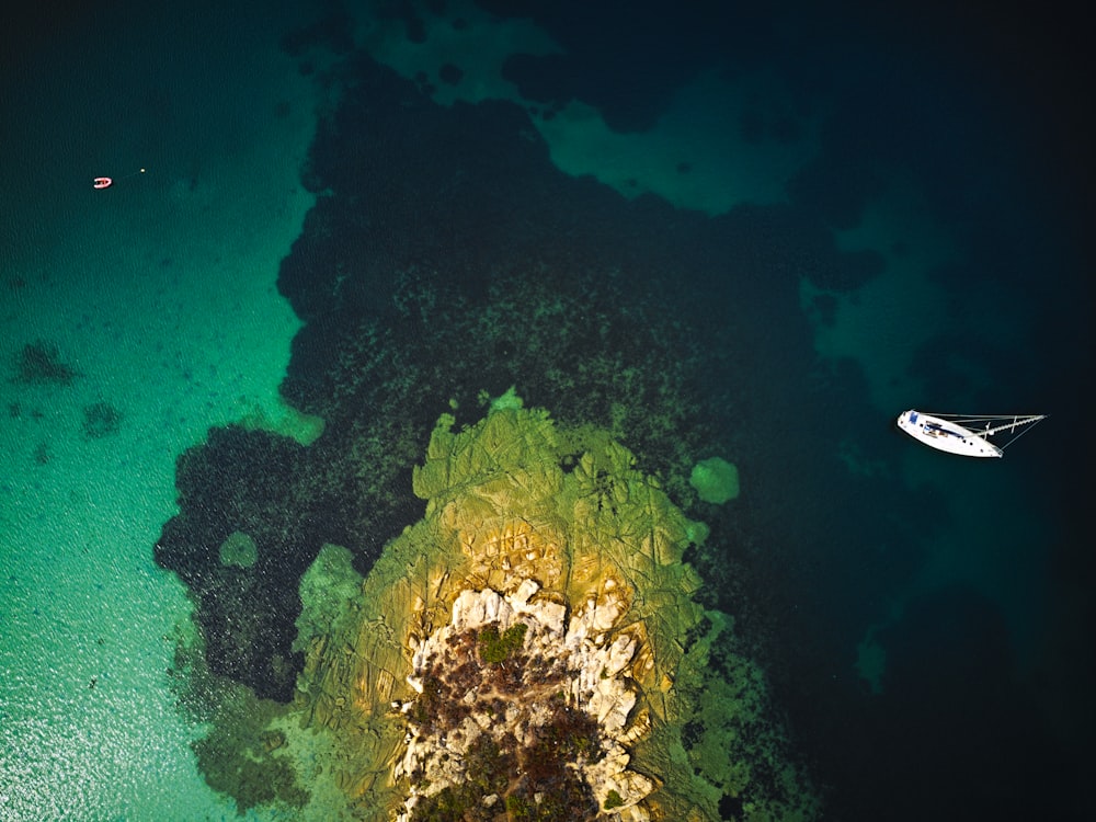 an aerial view of a boat in the water