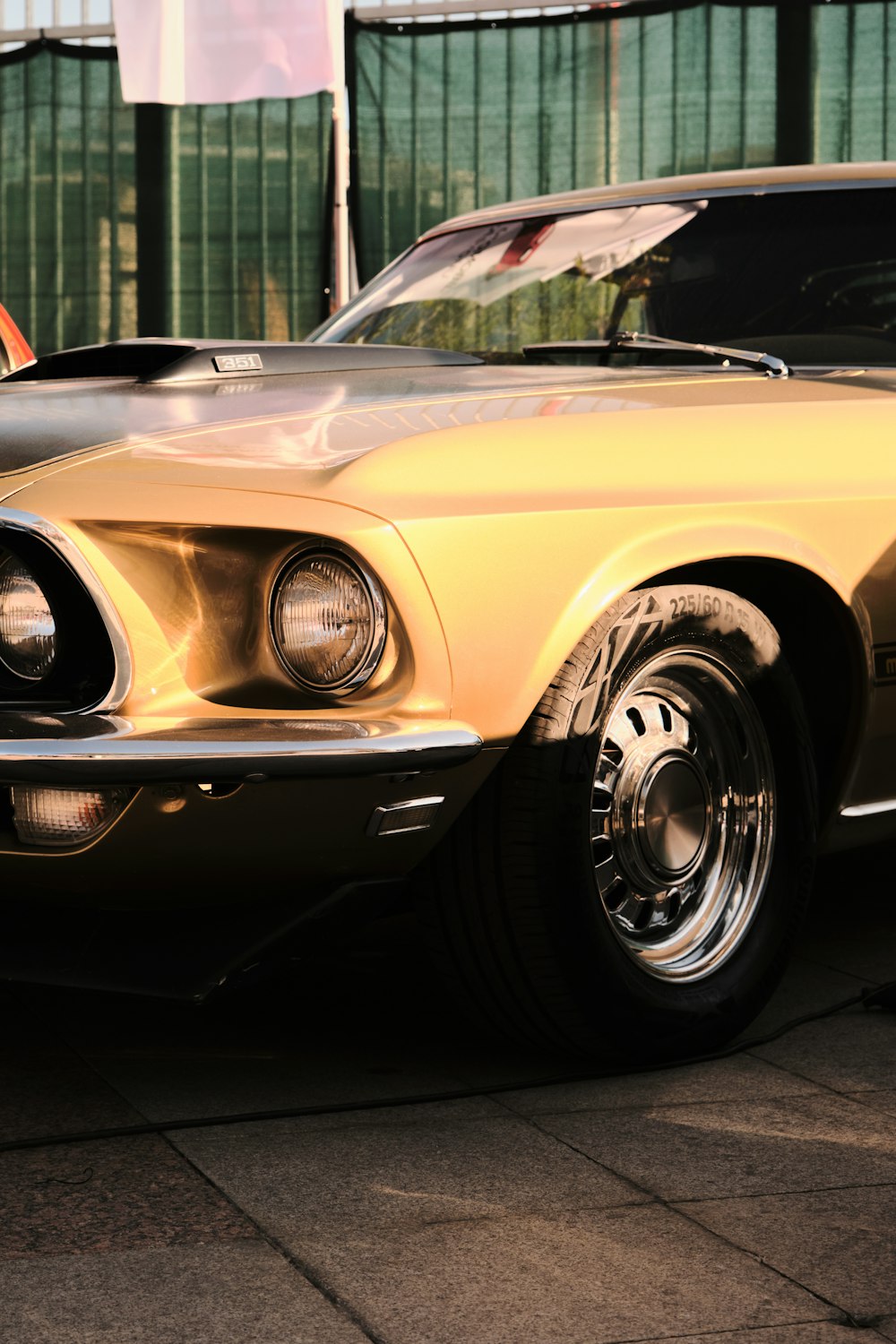 a yellow car parked in front of a building