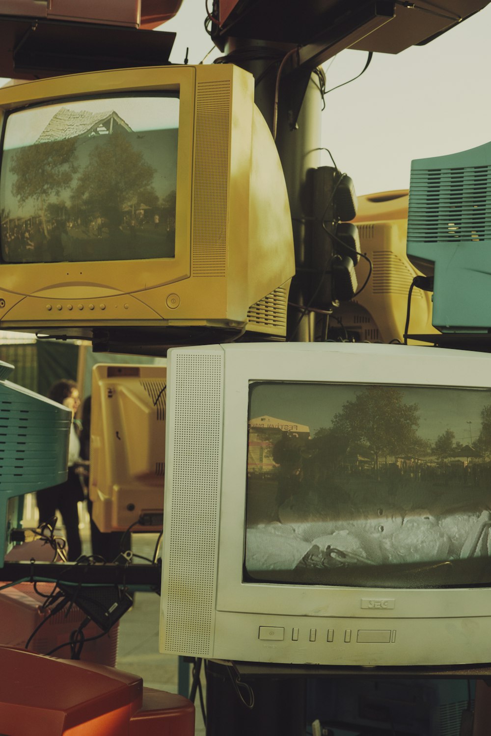 a pile of old televisions sitting on top of each other