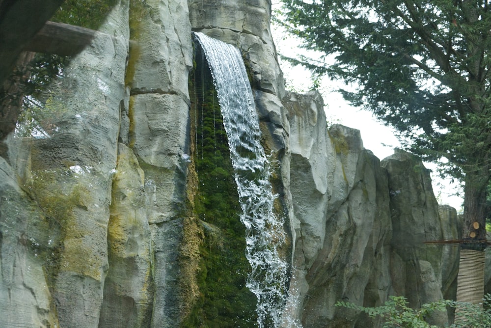 a waterfall in the middle of a rocky area