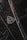 A close-up of a luxury car emblem adorned with raindrops, showcasing sleek chrome details against a dark, glossy surface.