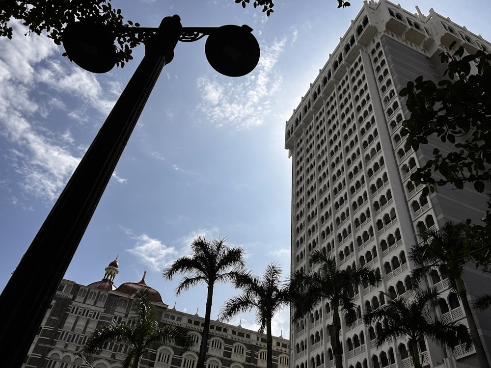 a street light in front of a tall building