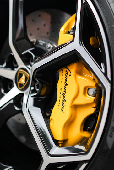 Brake pads installed on a car wheel, highlighting their sturdy design and fit.