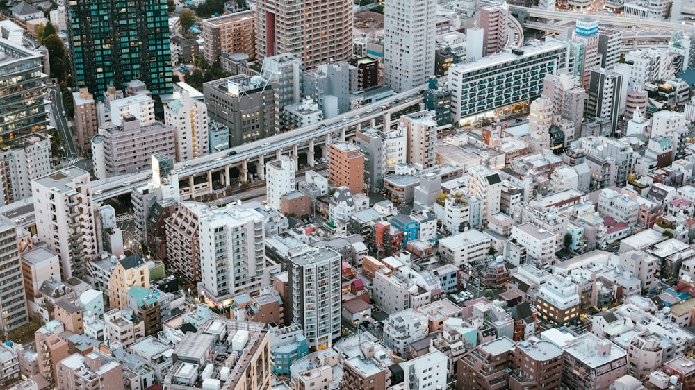 an aerial view of a city with lots of tall buildings