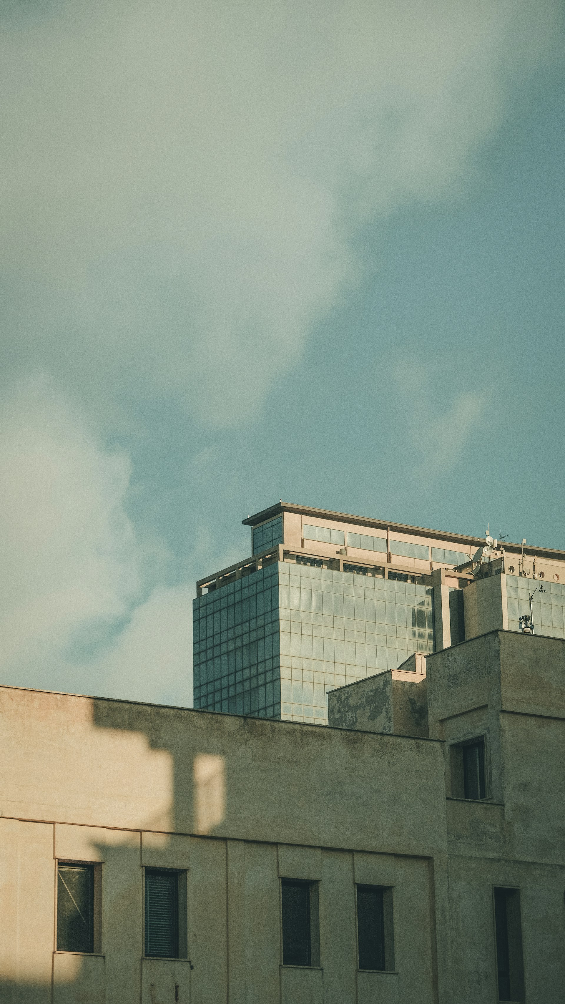 a tall building with a clock on the top of it