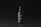 A cosmetic spray bottle with a dark green label and black cap is centered in a minimalistic setting. The label includes text and a small QR code. The background is a simple matte black, which highlights the product.