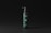 A sleek, dark green bottle with a black pump dispenser is set against a matte black background. The bottle features minimalist text branding, and the overall design exudes elegance and simplicity.