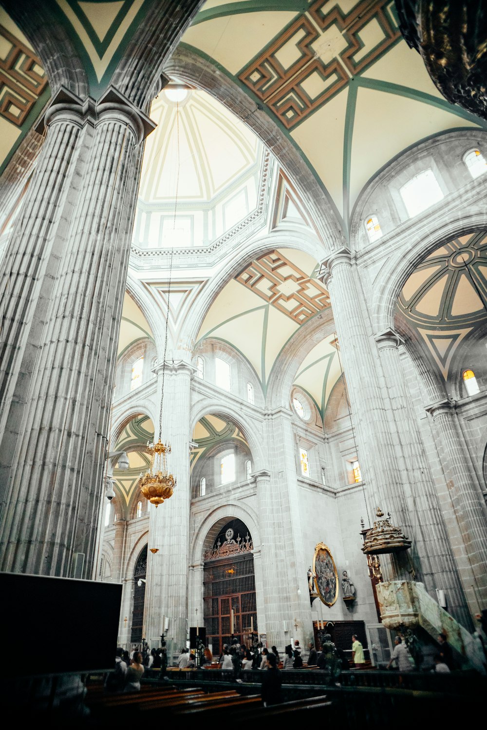 a large cathedral with columns and a chandelier