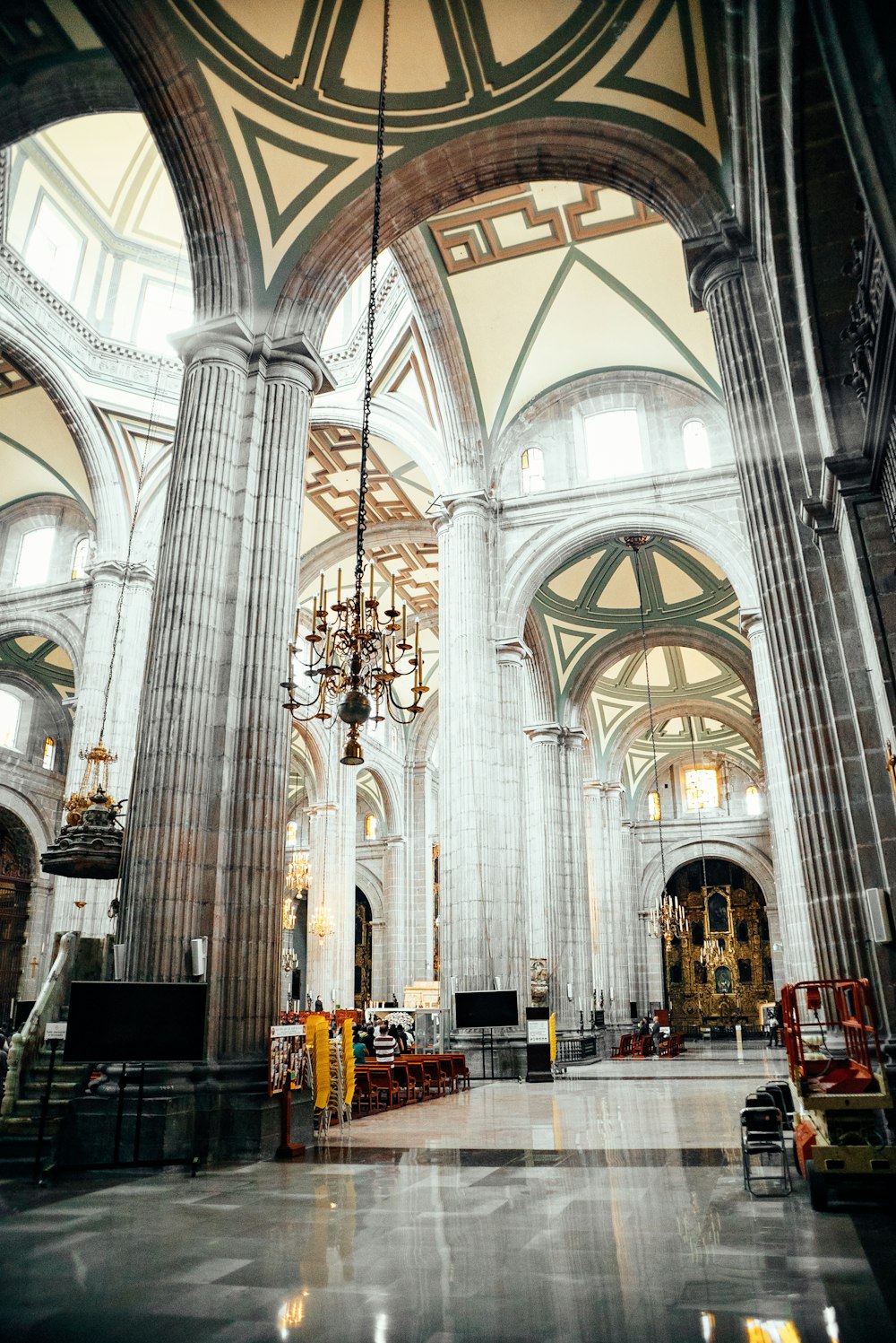 a large cathedral with a chandelier hanging from the ceiling