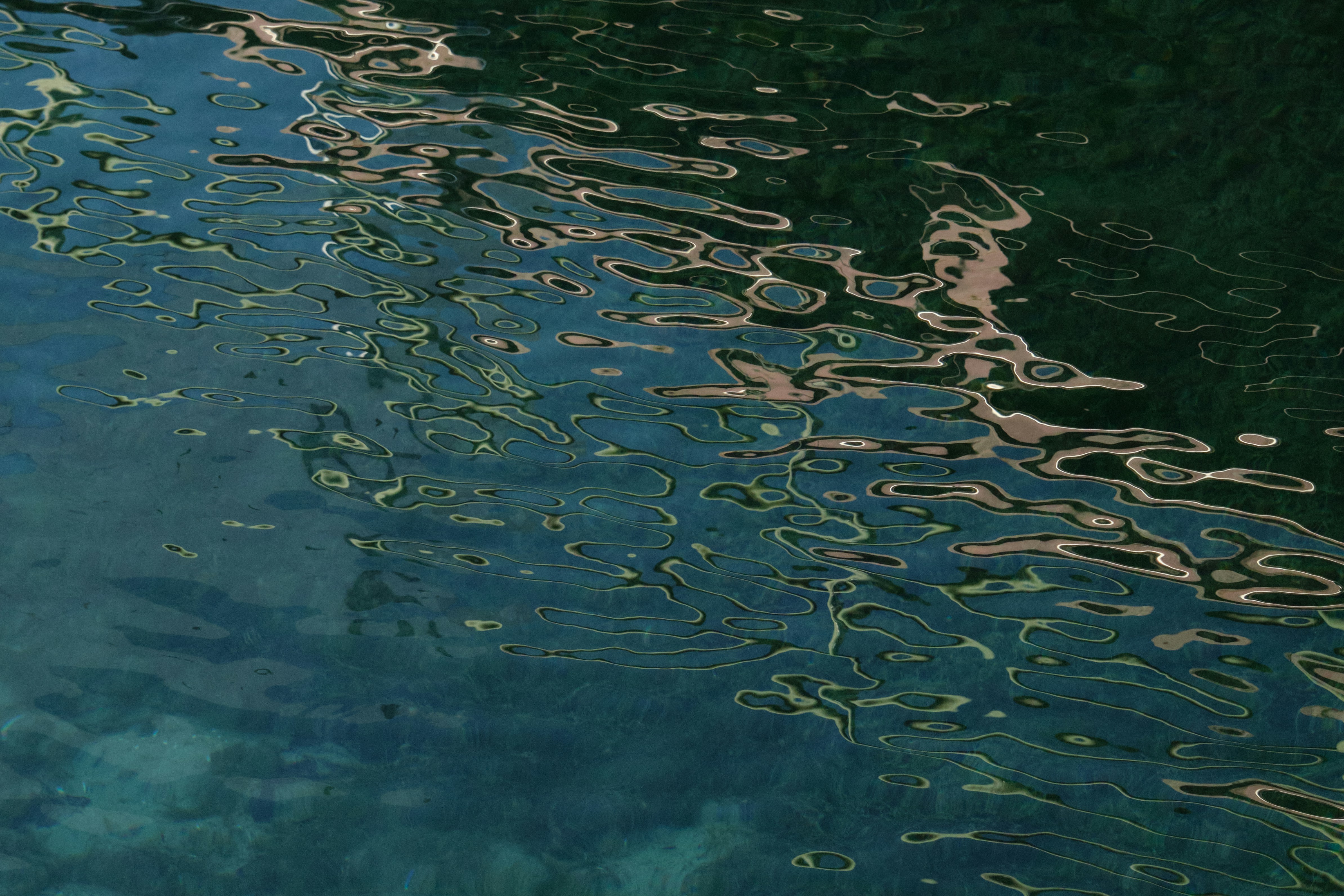 the reflection of a boat in the water