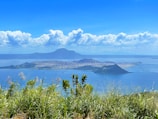 A scenic view of Lake Toba with mountains in the background.