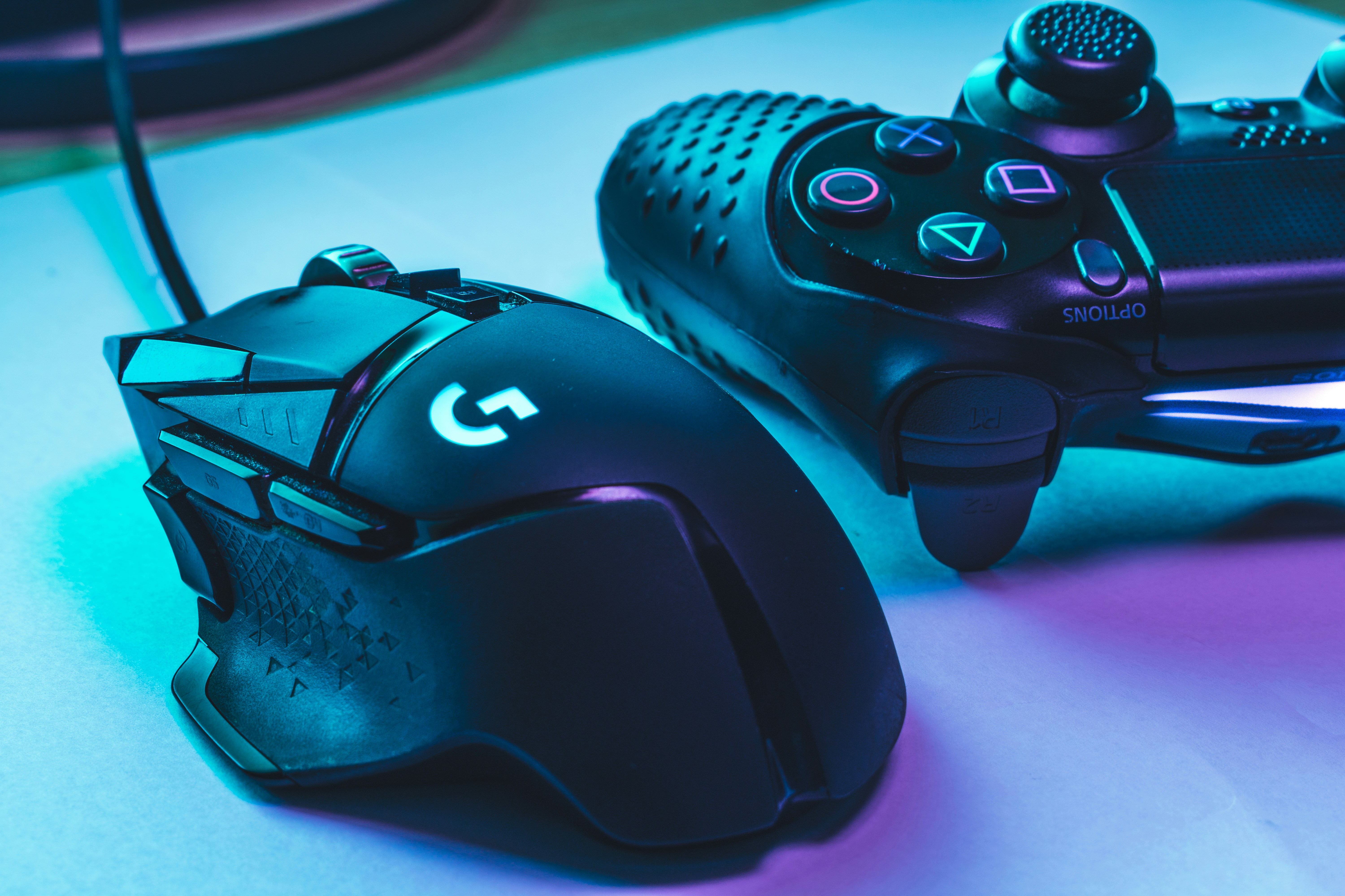 Logitech G502 Hero and a DualShock 4 PlayStation 4 controller