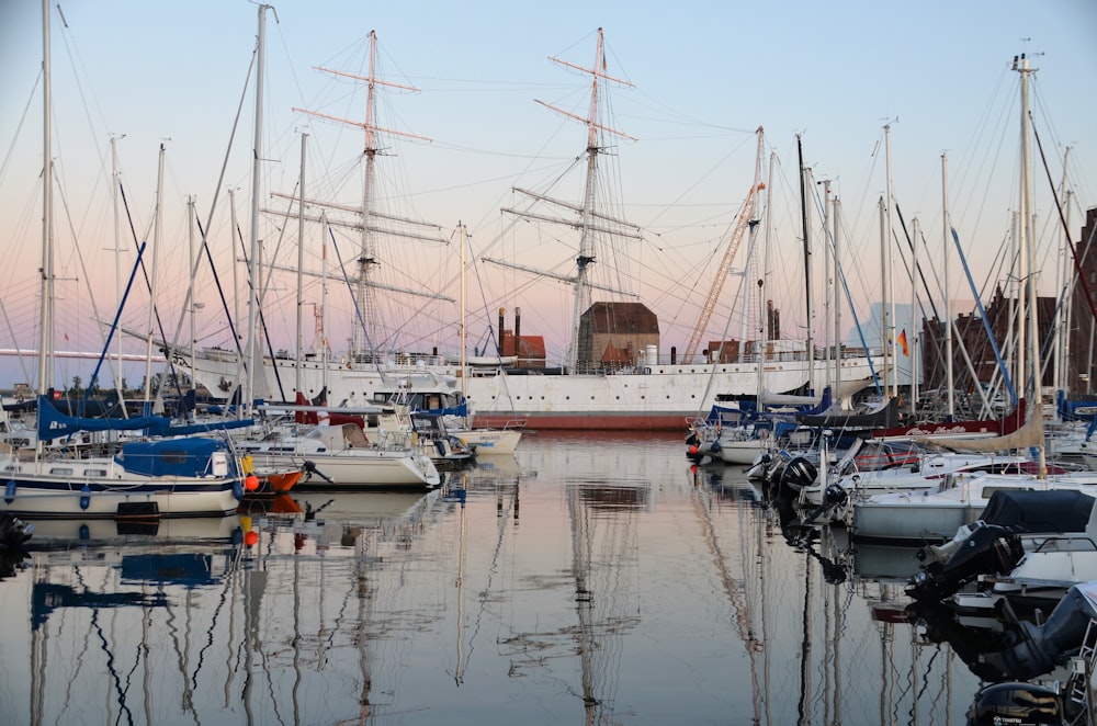 a group of boats that are sitting in the water