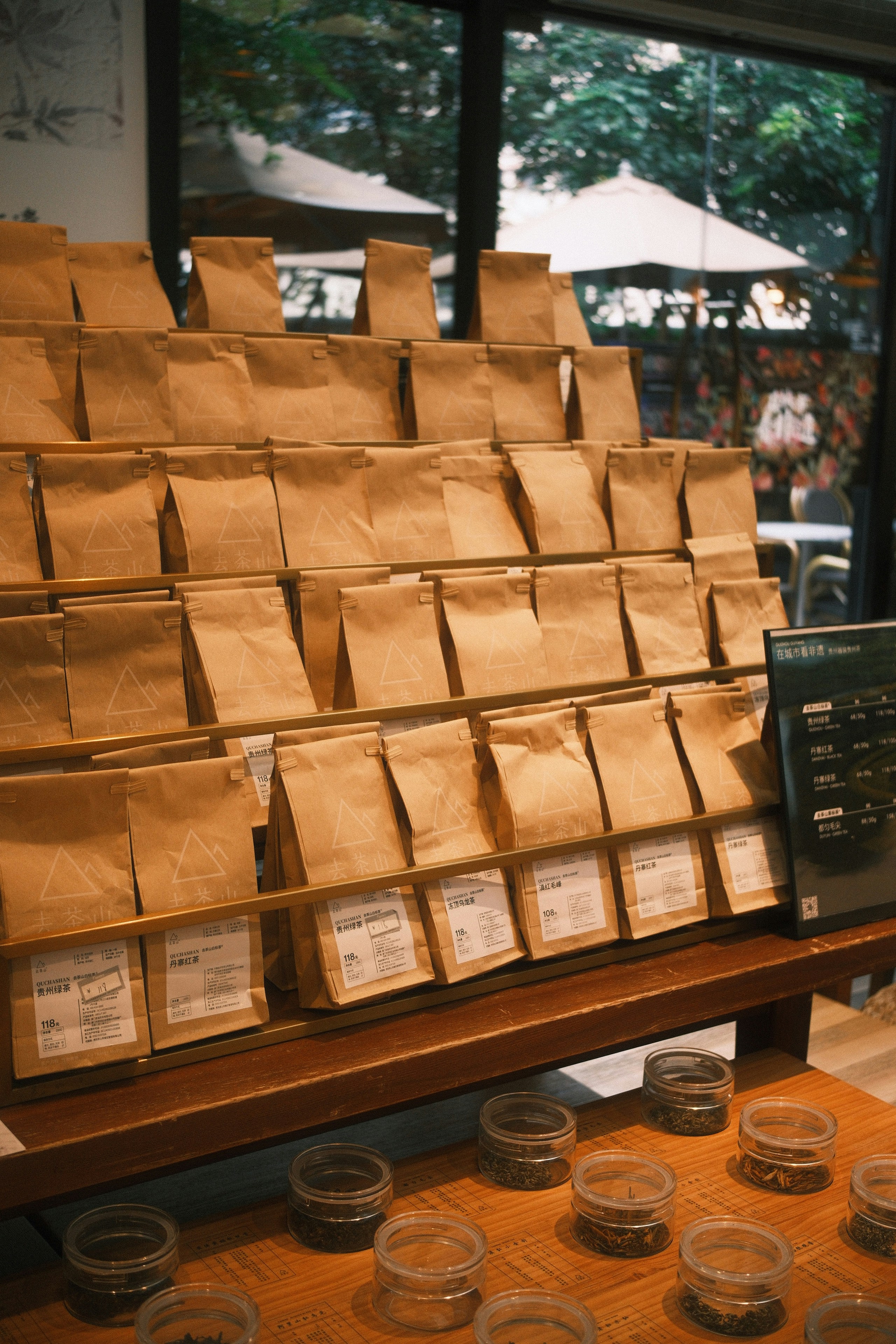 a display case filled with lots of brown paper bags