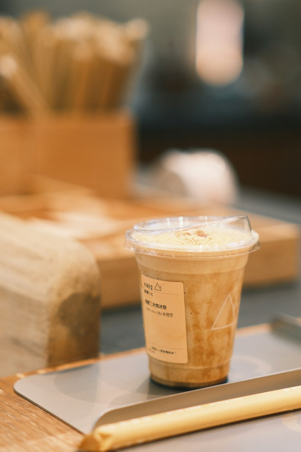 a cup of coffee sitting on top of a wooden table