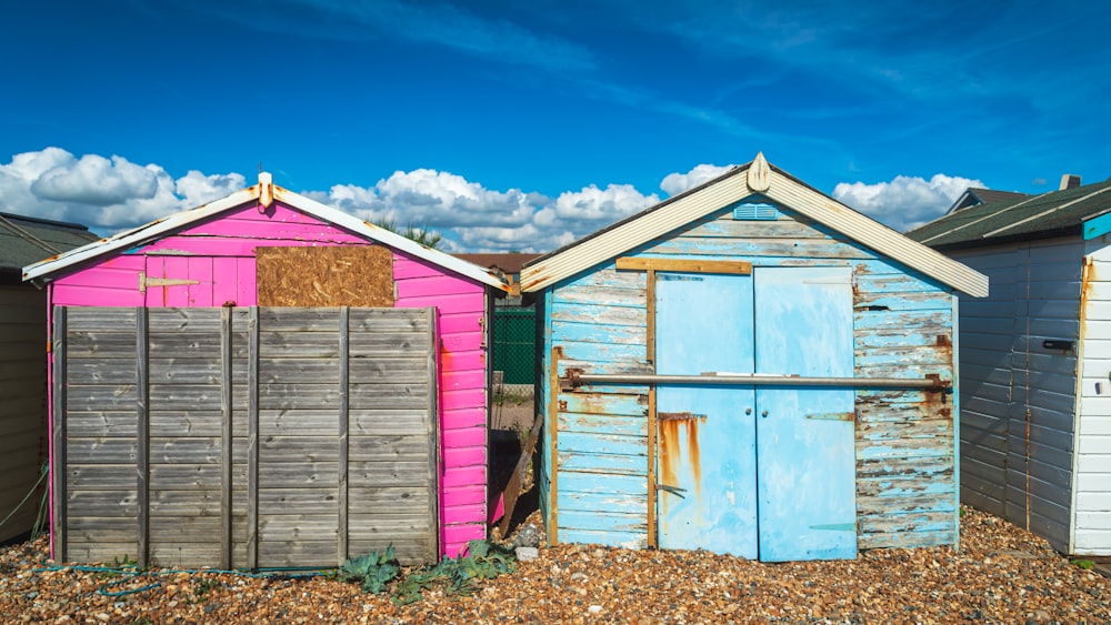 a row of beach huts sitting next to each other