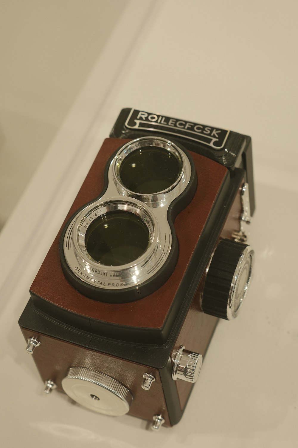 an old camera sitting on top of a table