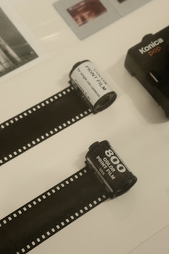 a couple of rolls of film sitting on top of a table