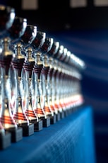 a row of wine glasses sitting on top of a table