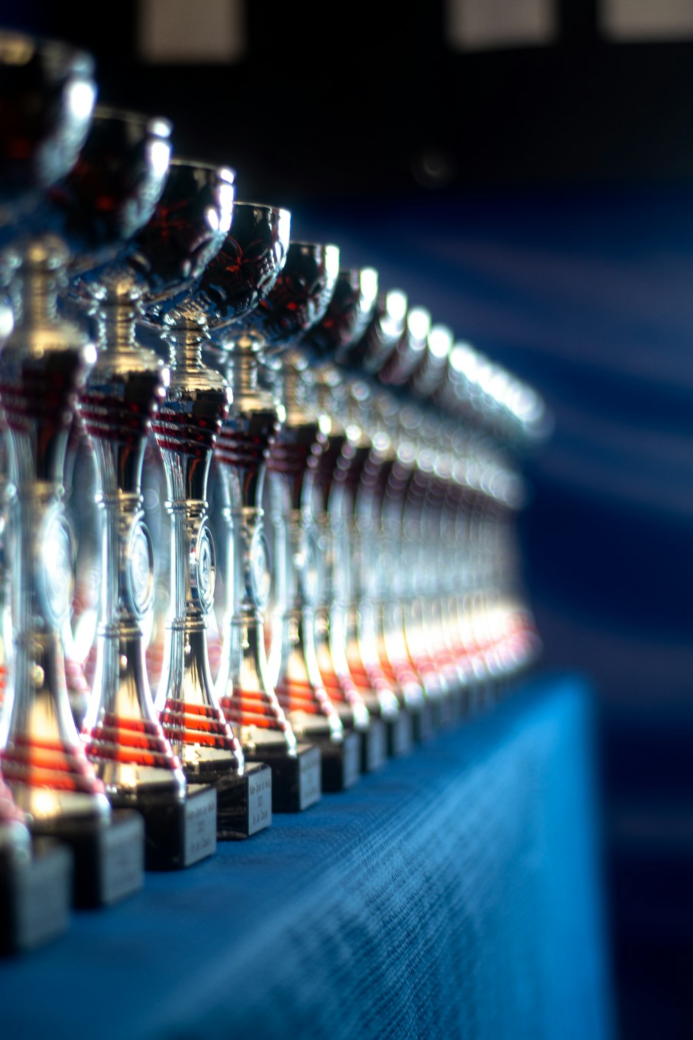 a row of wine glasses sitting on top of a table