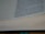 A close-up view of an open book showing text on the right page, with visible lines and spaces on the left page, suggesting note-taking sections. The text is in English and appears to be centered vertically as if captured at a slight angle, revealing the thickness of the pages.