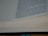 A close-up view of an open book showing text on the right page, with visible lines and spaces on the left page, suggesting note-taking sections. The text is in English and appears to be centered vertically as if captured at a slight angle, revealing the thickness of the pages.