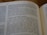 A close-up view of a page from an open book, specifically from the Old Testament, displaying text in paragraphs. The focus is on the words 'Israel’s restoration assured' and surrounding text, with some parts slightly blurred due to shallow depth of field.
