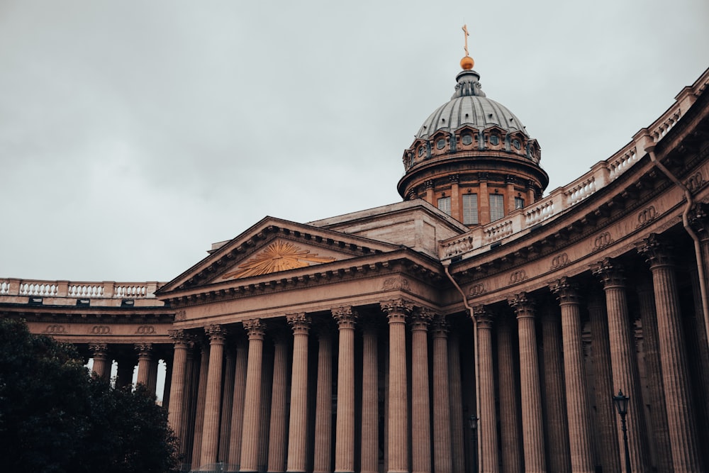 a large building with columns and a dome on top