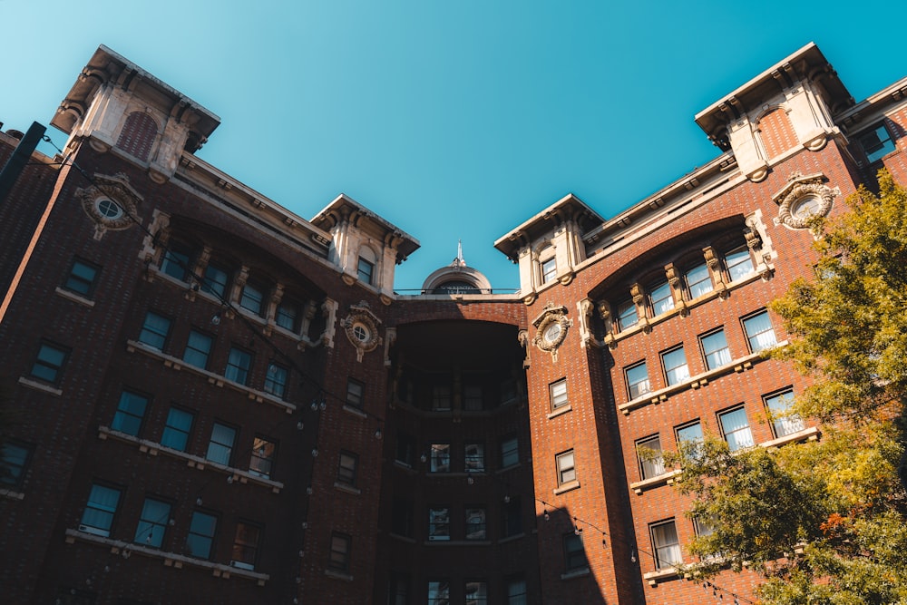 a tall building with a clock on the front of it