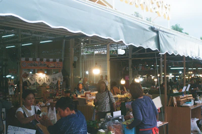 A vibrant street market in Southeast Asia bustling with colors, spices, and local artisans.
