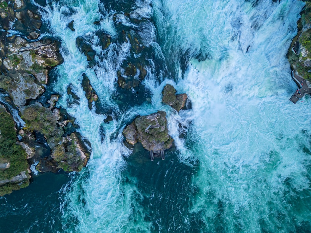 an aerial view of a waterfall in the ocean