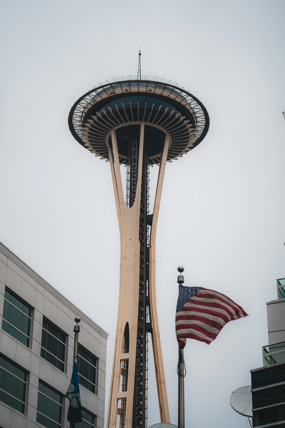 a tall tower with a flag on top of it