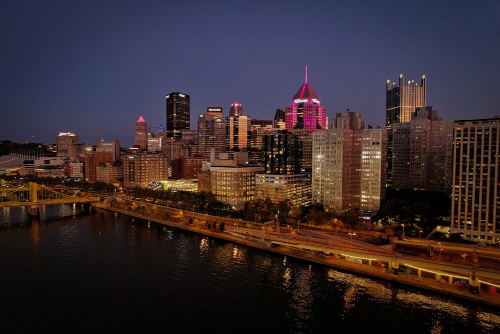 a view of a city at night from a bridge