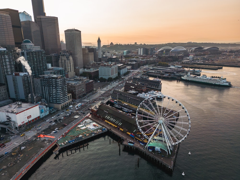 an aerial view of a city with a ferris wheel