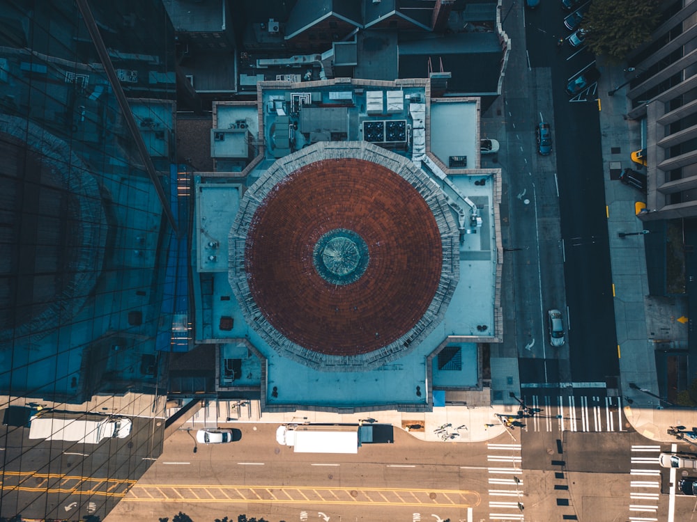 an aerial view of a building with a red roof