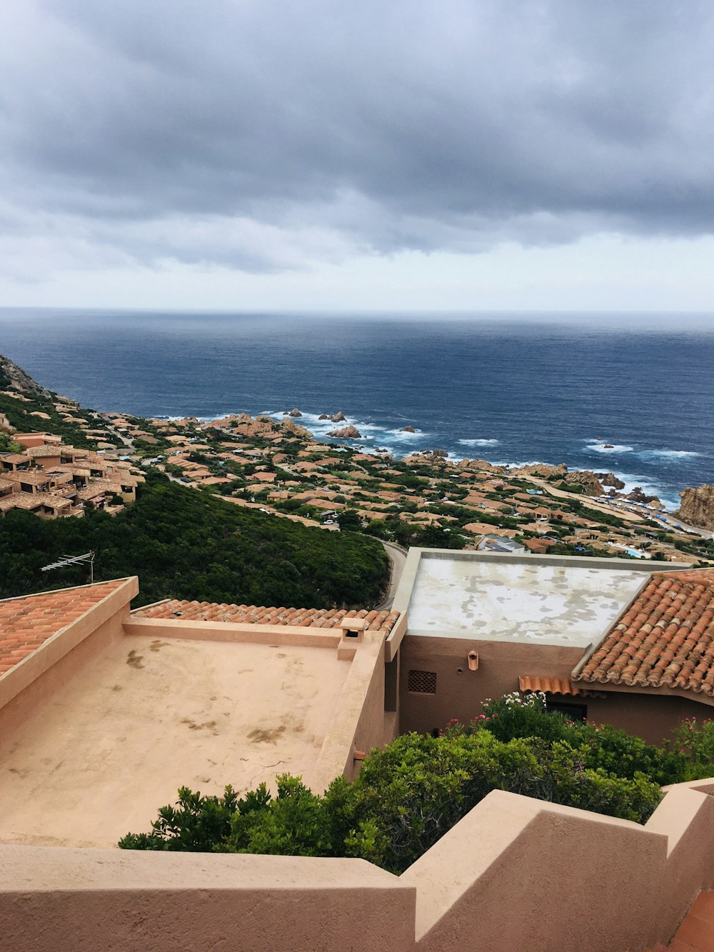 a view of the ocean from the top of a building