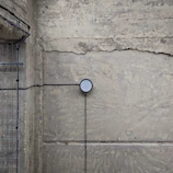 Close-up of moisture detection equipment on a wall inside a modern apartment.