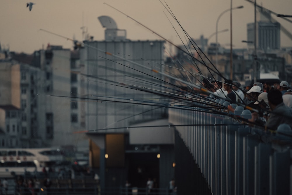 a group of people standing on top of a bridge