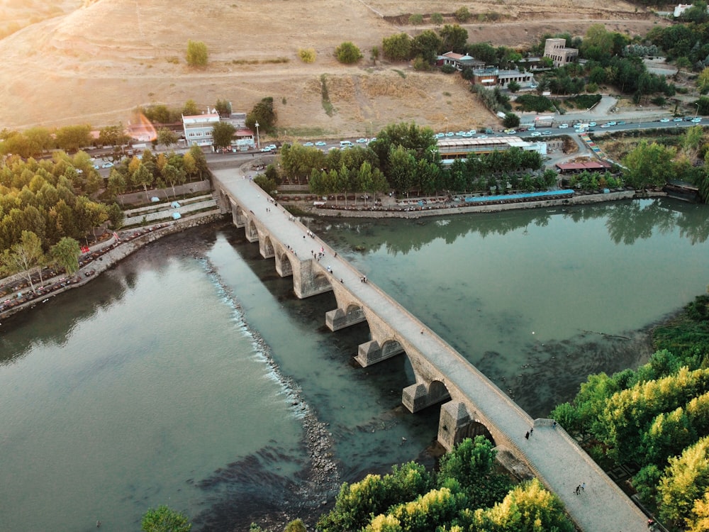 an aerial view of a bridge over a river