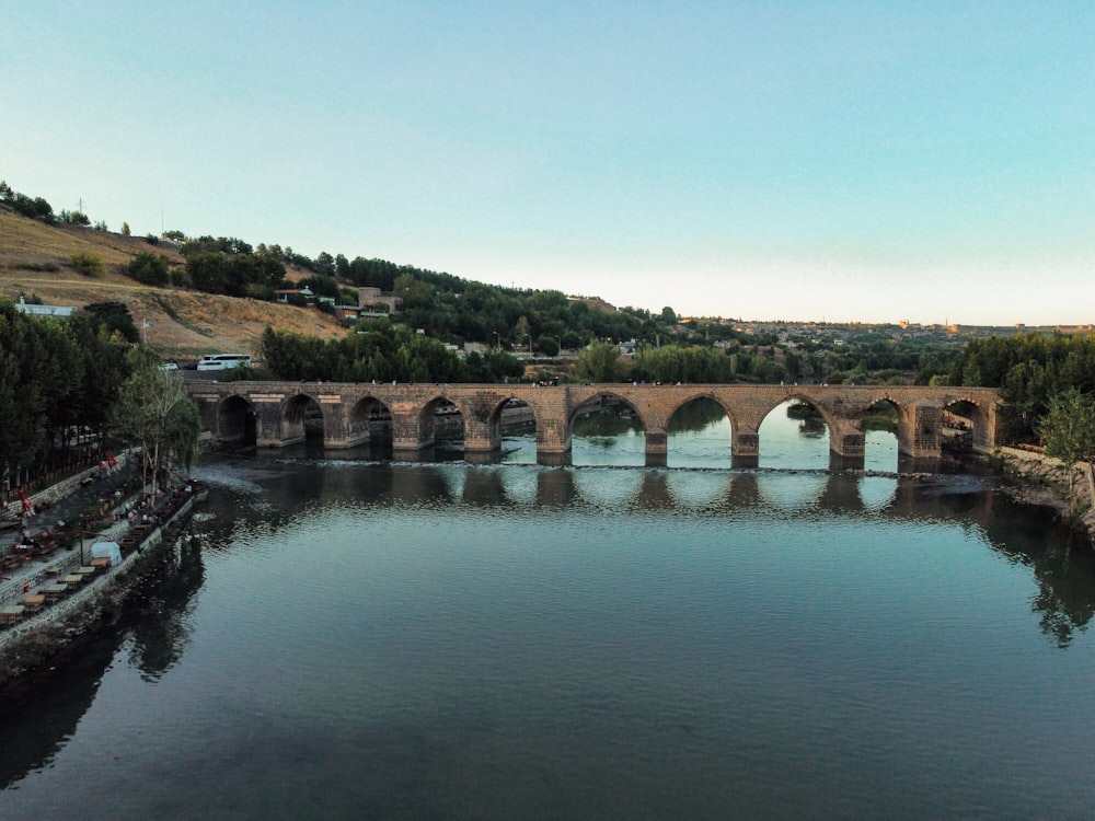 a bridge over a river with boats on it