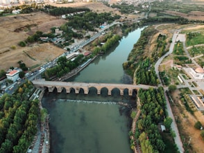 an aerial view of a bridge over a river