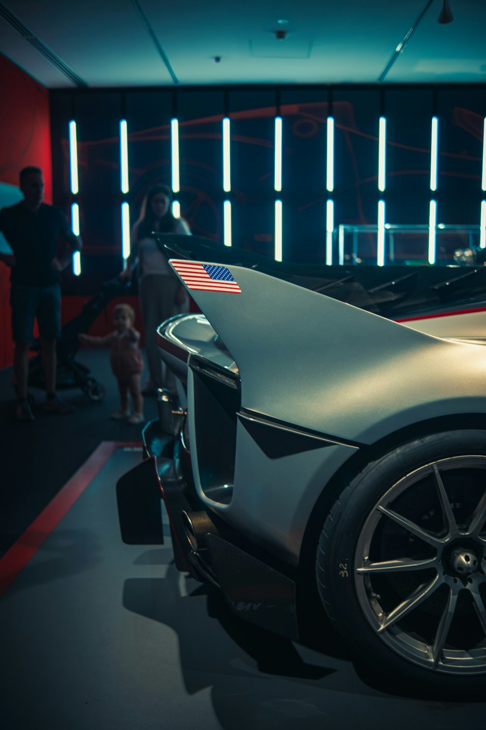 a silver sports car parked in a garage