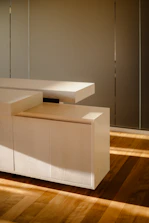 Monochrome image of a custom wooden cabinet with clean lines and modern design.