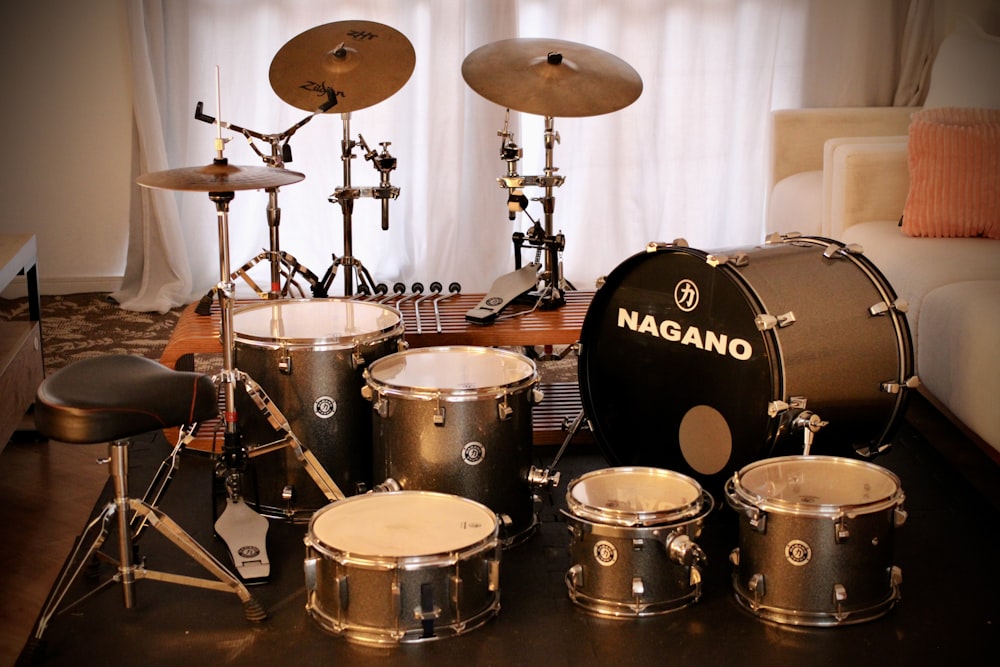 a set of drums and drumsticks sitting on a table