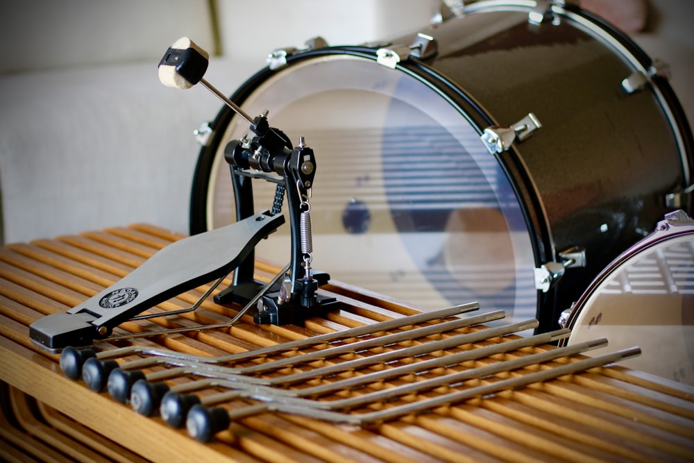 a drum set sitting on top of a wooden table